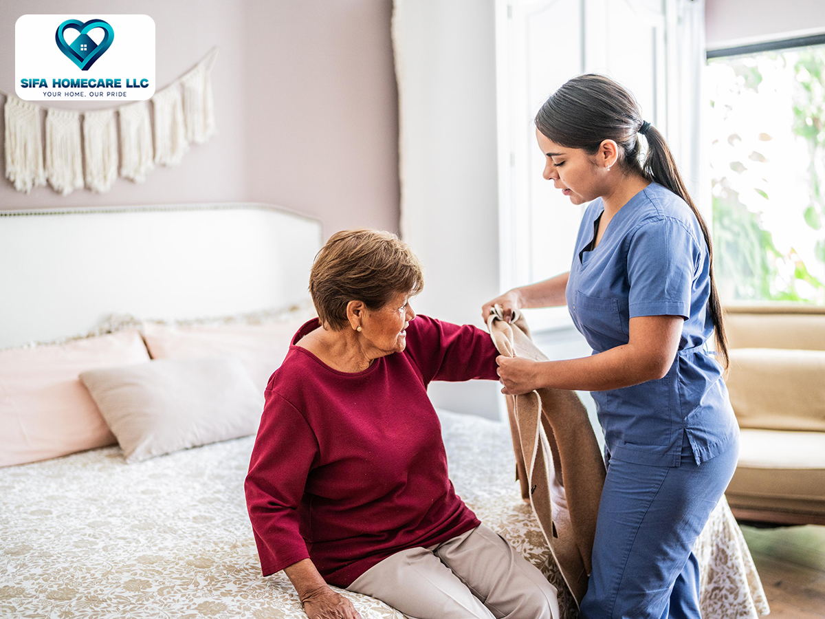 Caregiver providing mobility assistance to an older adult at home in Puyallup, WA